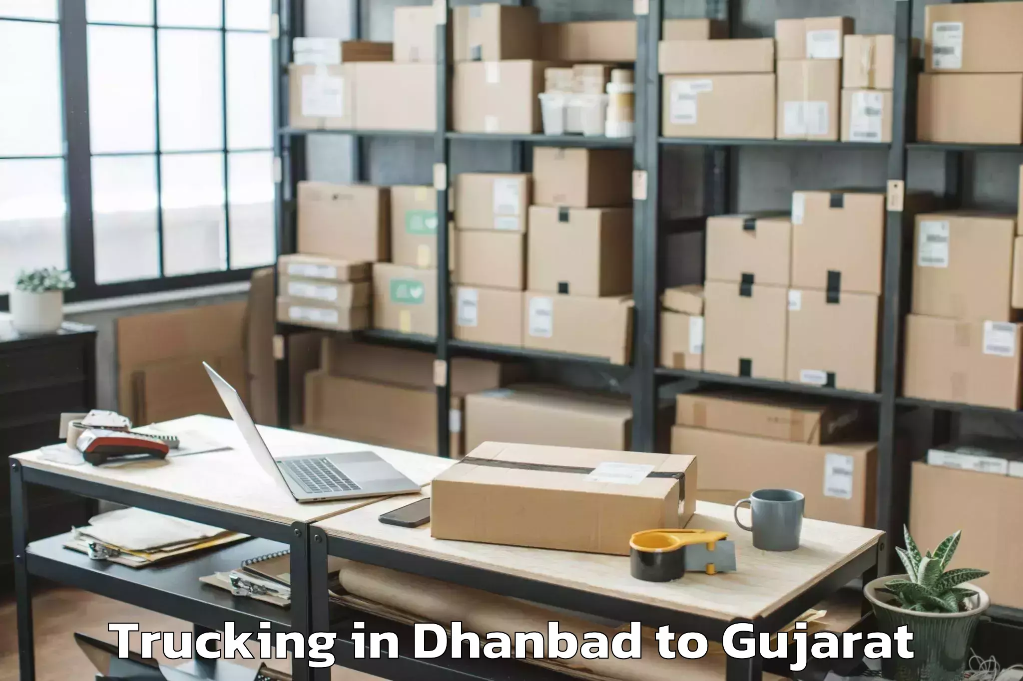 Affordable Dhanbad to Udhana Trucking